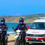 Moroccan police motorcycles and patrol vehicle on beach in Agadir