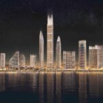 Projet Binghatti - tours modernes illuminées avec reflets sur l'eau