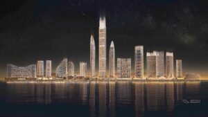Desarrollo Binghatti Pinnacle - torres iluminadas con reflejos en el agua