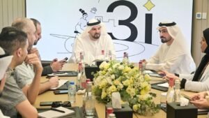 Executives in meeting discussing credit scoring system launch with presentation backdrop